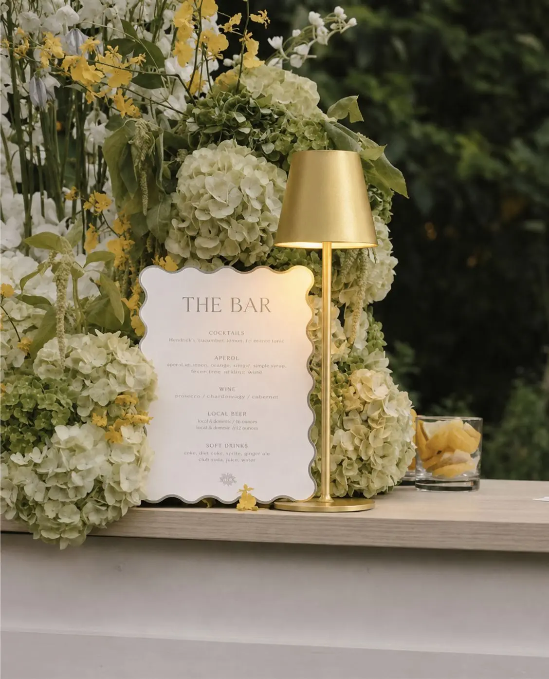 Modern gold rechargeable LED table lamps that provide soft ambient lighting. Featuring touch controls and adjustable brightness, these sleek lamps are perfect for guest tables, cocktail tables, bars, and lounge areas for any event.